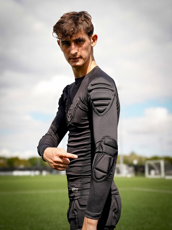 Goalkeeper wearing a padded Hundred top
